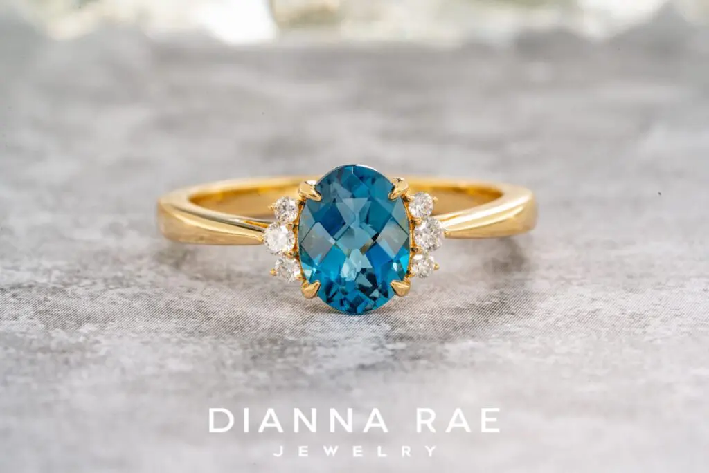14K Yellow Gold Oval Blue Topaz Ring with Diamond Accents