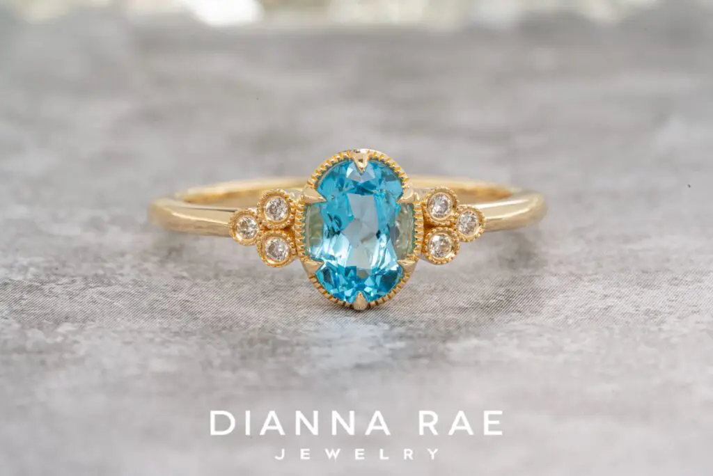 14K Yellow Gold Blue Topaz Ring with Diamond Accents