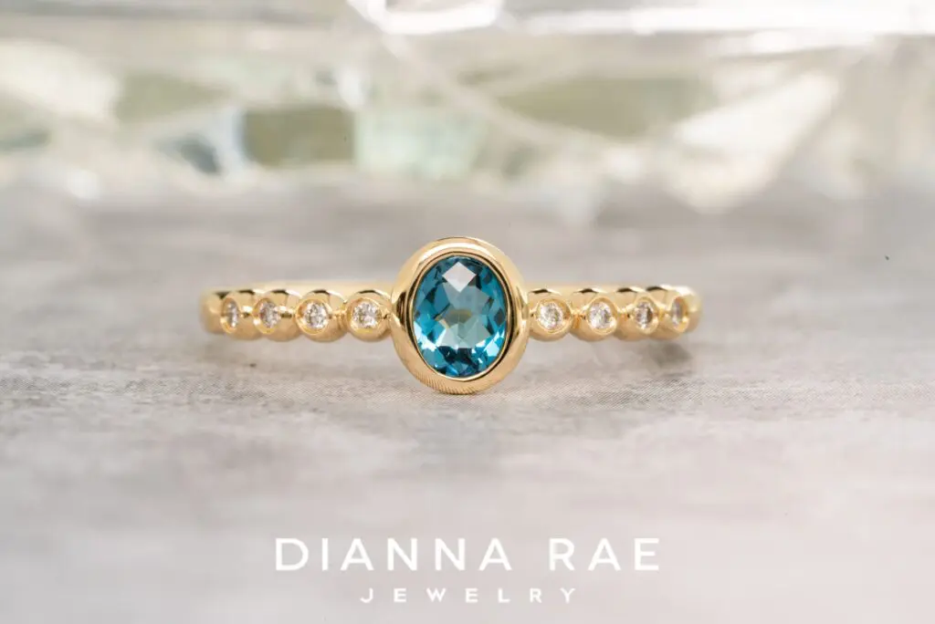 14K Yellow Gold Blue Topaz Ring with Diamond Accents