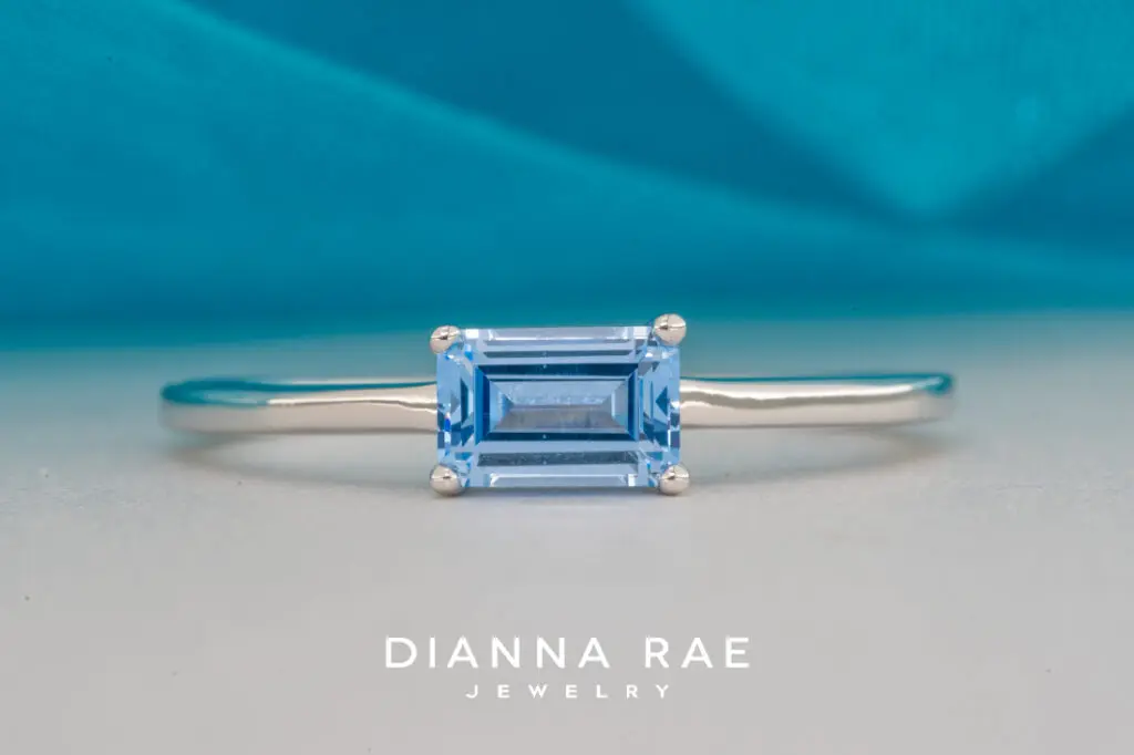 10K White Gold Ring with an Imitation Aqua Center Stone