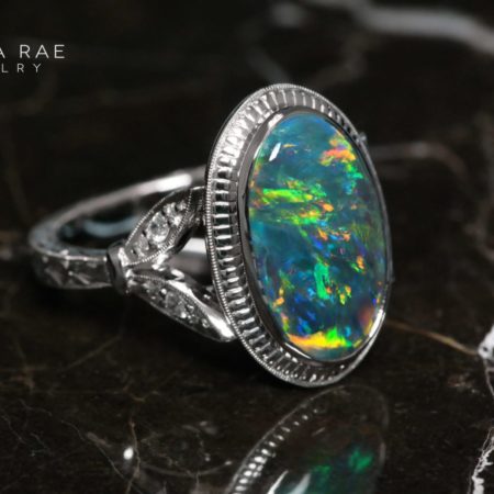 001-01619-001_DRJ_PlatinumOval-Opal-Ring-with-Hand-Engraved_front-marble-1-scaled