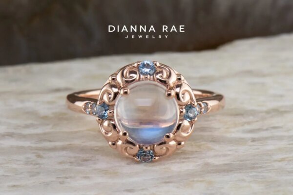 Rose Gold Round Moonstone Halo Ring with Aquamarine Accents