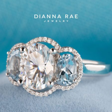 001-11701-001_STU71602_White-Gold-Three-Stone-Oval-Moissanite-Engagement-Ring-with-Aquamarine-Sides-Diamond-Halo-Accents_02