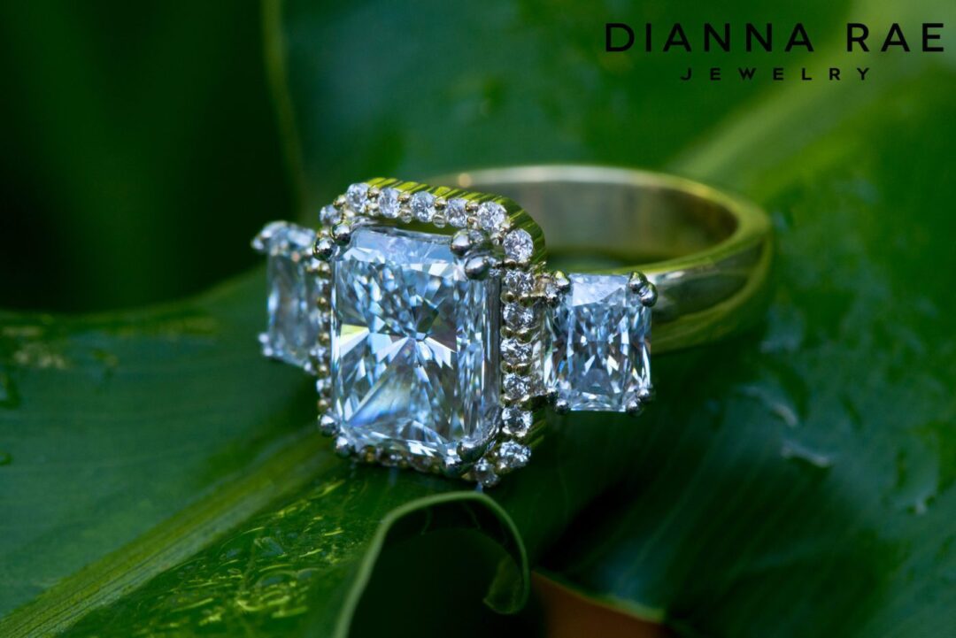 Two-tone Radiant Three Stone Engagement Ring with Center Halo