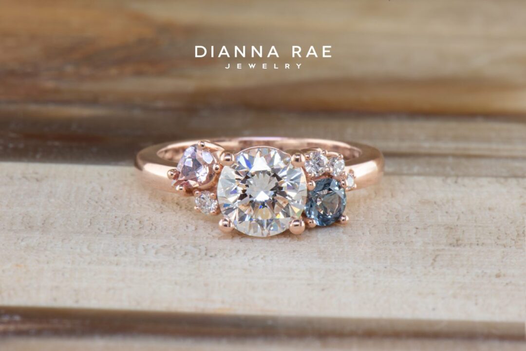 Lotus - Rose Gold Round Diamond Asymmetrical Engagement Ring with Montana Sapphire and Lotus Garnet Accents - Image 4