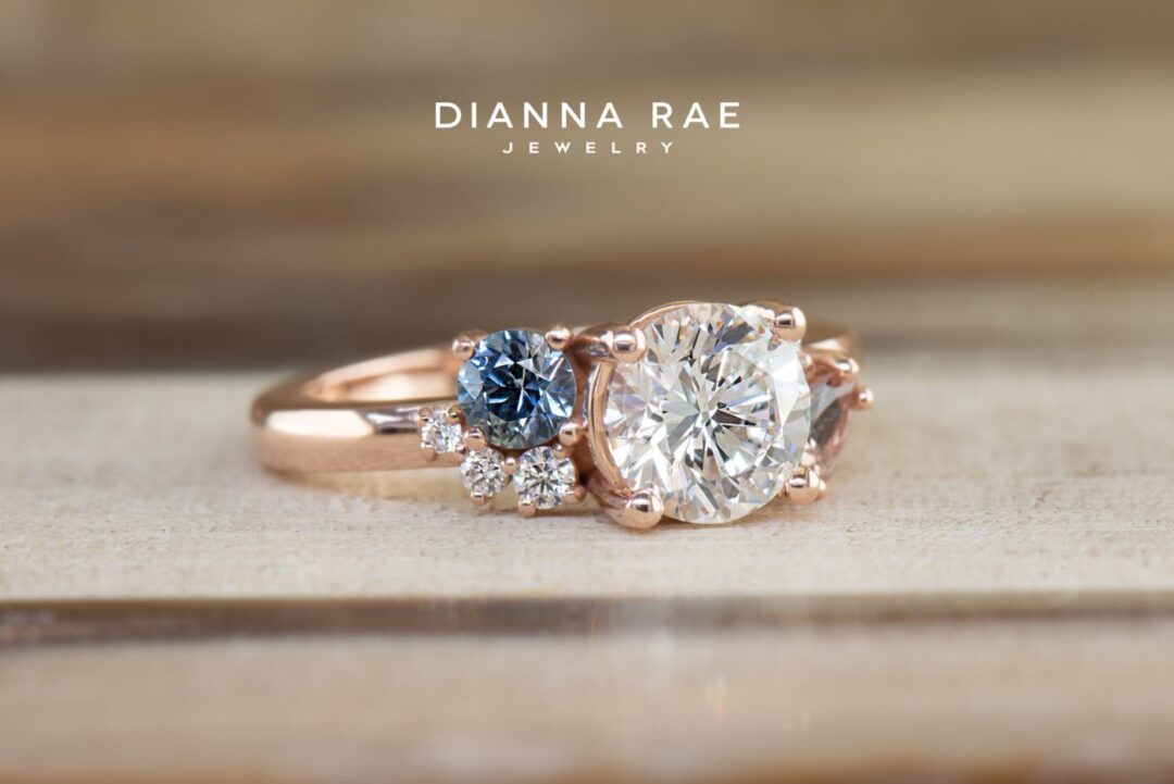 Lotus - Rose Gold Round Diamond Asymmetrical Engagement Ring with Montana Sapphire and Lotus Garnet Accents - Image 3