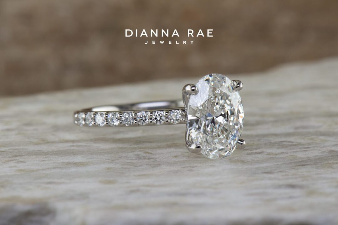 Platinum Oval Diamond Solitaire Engagement Ring with Diamond Accents