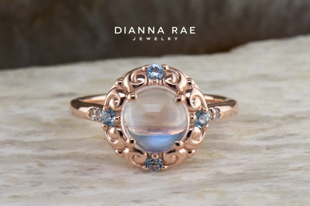Rose Gold Round Moonstone Halo Ring with Aquamarine Accents
