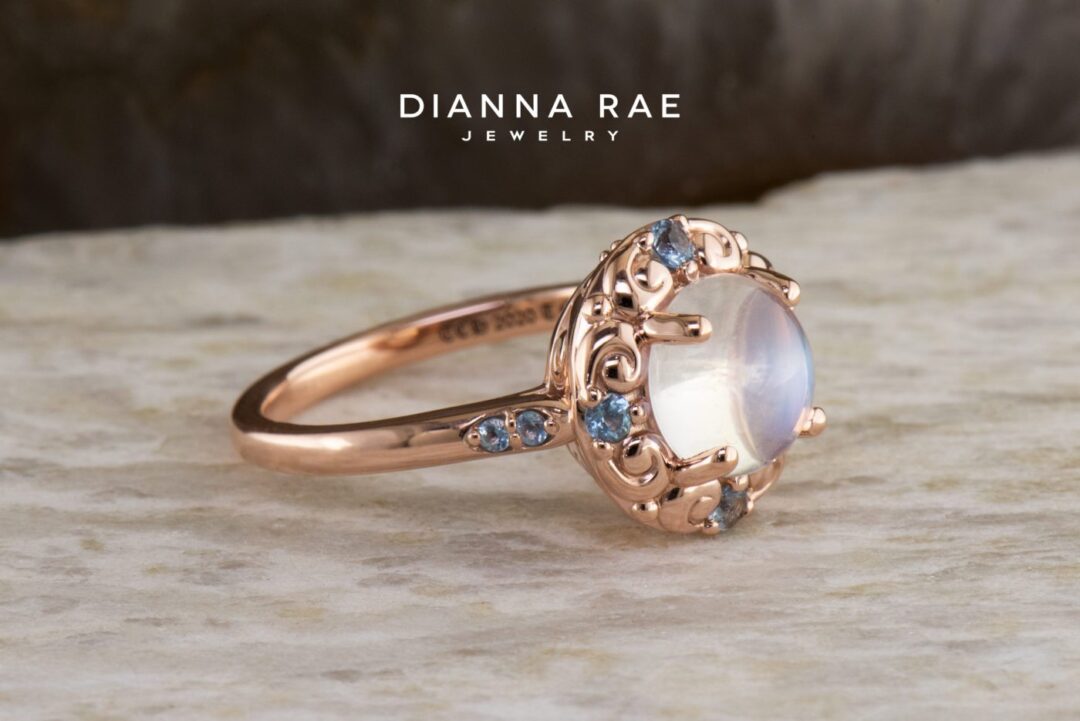 Rose Gold Round Moonstone Halo Ring with Aquamarine Accents - Image 2