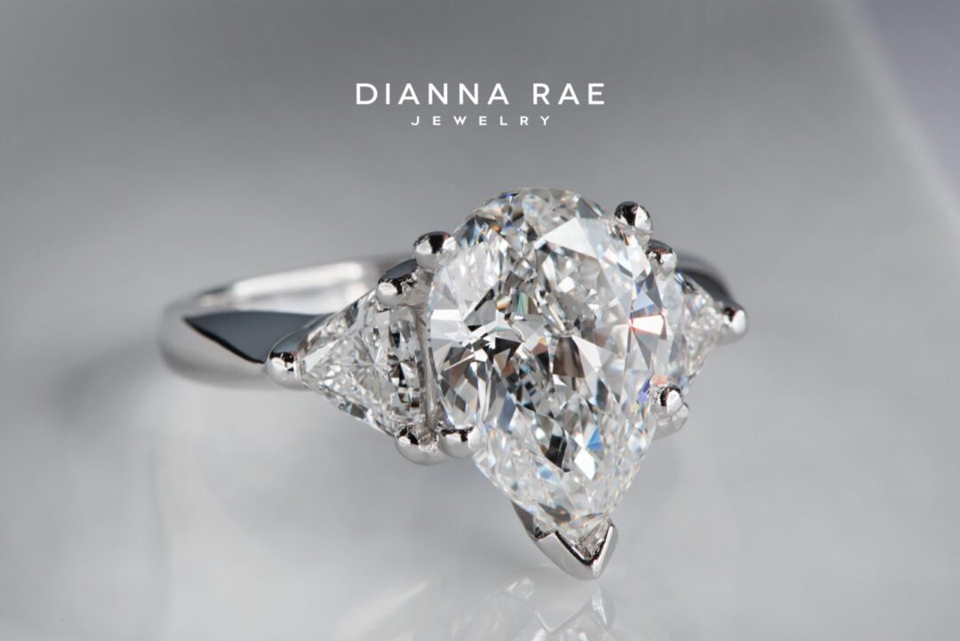 Platinum Pear Shape Diamond Three Stone Ring with Trillion-Cut Diamond Sides