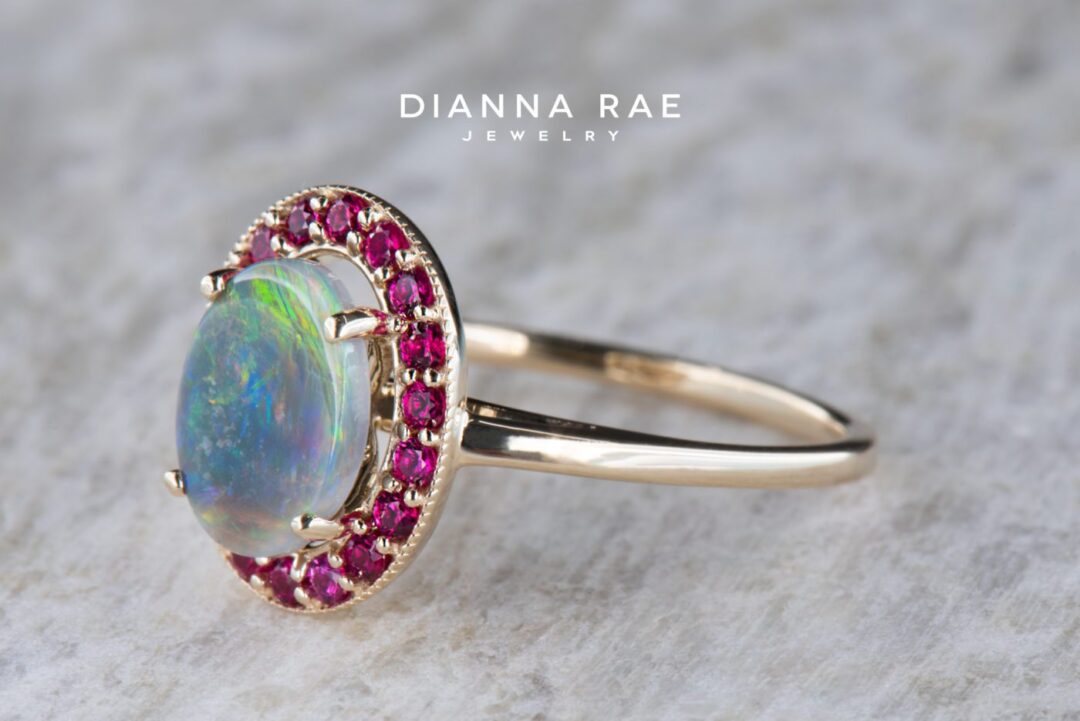 Yellow Gold Oval Black Opal Halo Ring with Ruby Accents - Image 2