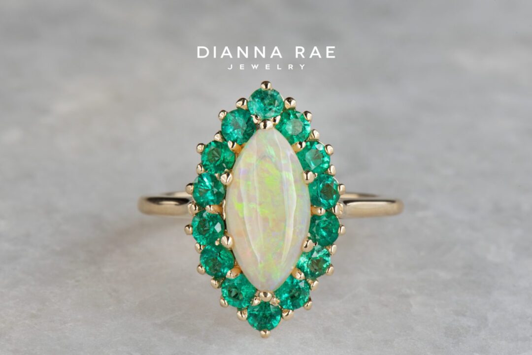 Yellow Gold Marquise Australian Opal Ring with Emerald Cluster Halo