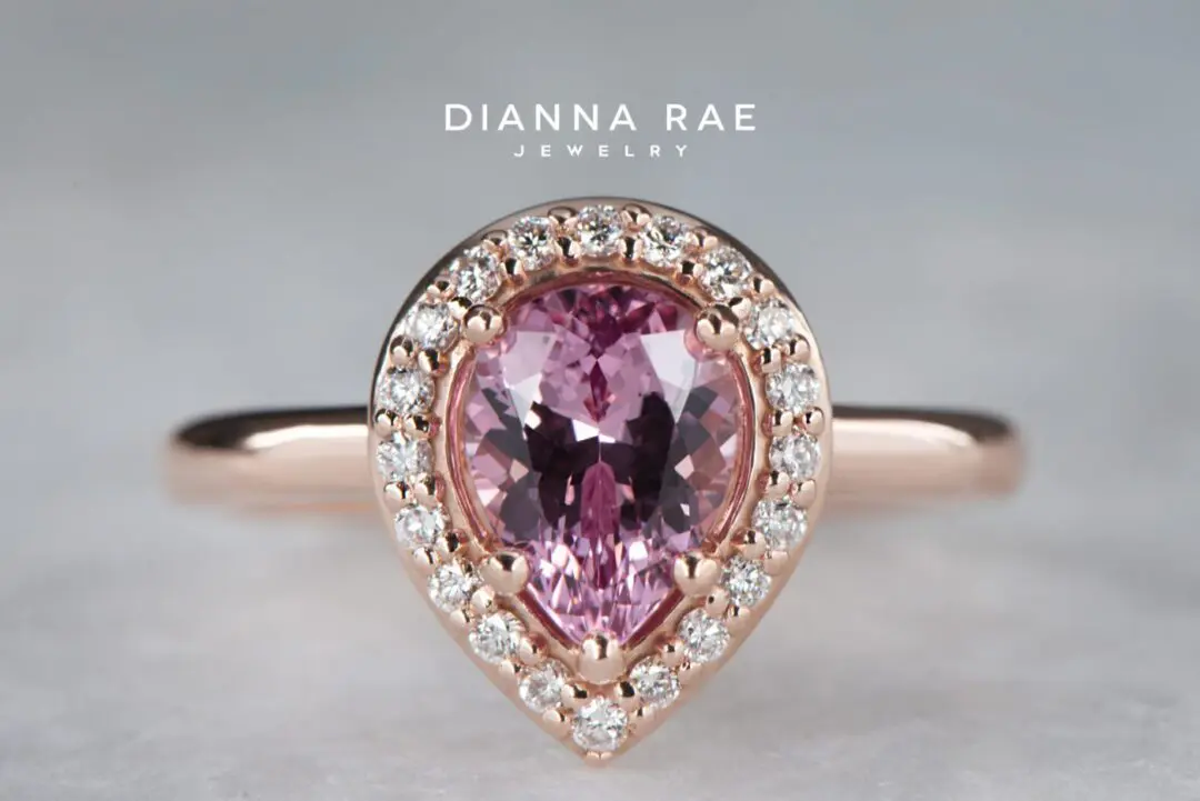 Rose Gold Pear-Shaped Lotus Garnet Halo Engagement Ring with Round Diamond Accents