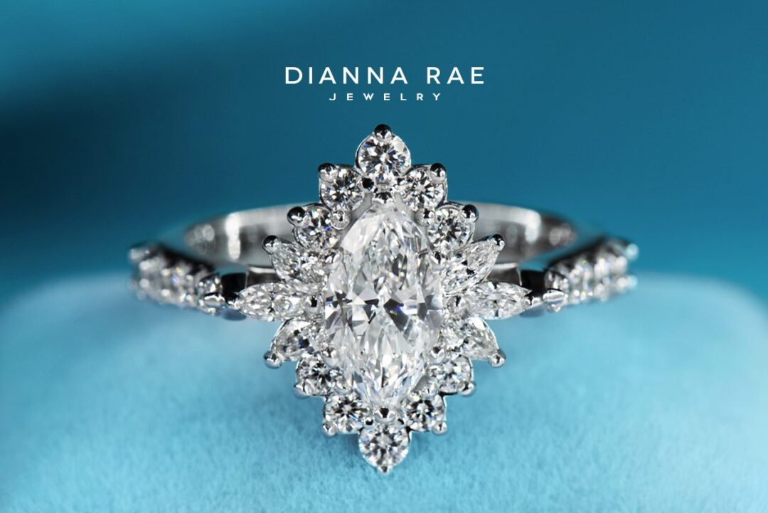 White Gold Marquise Diamond Halo Engagement Ring with Round Diamond Accents