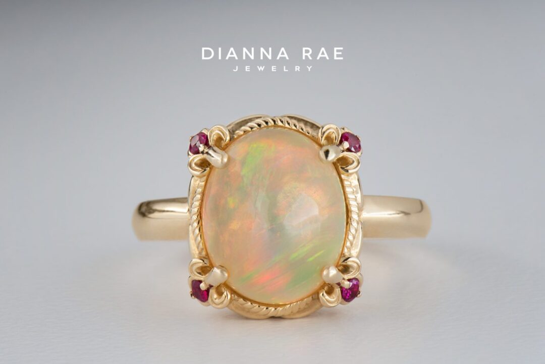 Yellow Gold Theatre Ring with Ethiopian Opal and Burmese Ruby Accents