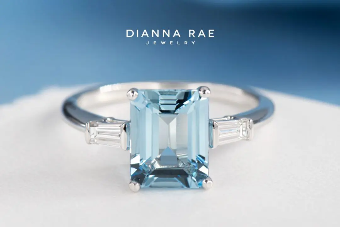 White Gold Emerald-Cut Aquamarine Three-Stone Ring with Tapered Baguette Diamond Sides