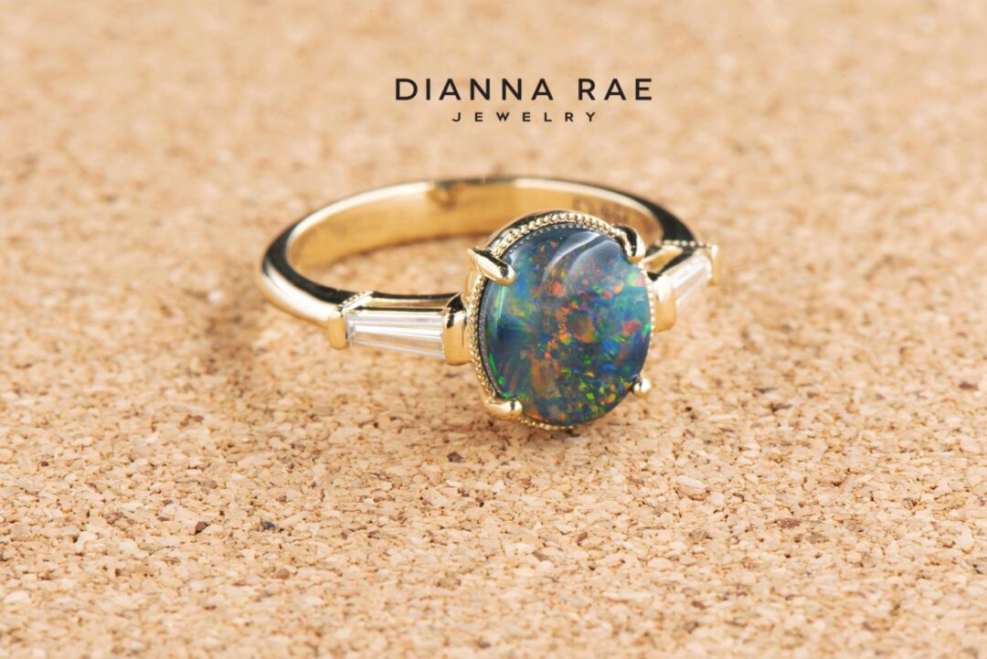 Yellow Gold Oval Black Opal Classic Three Stone Ring with Diamond Baguettes - Image 2