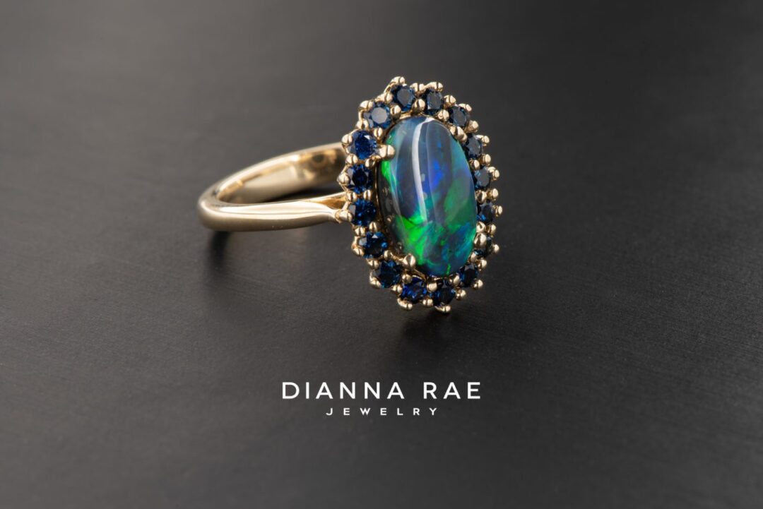 Yellow Gold Oval Black Opal Cluster Halo Cocktail Ring with Blue Sapphire Accents - Image 2