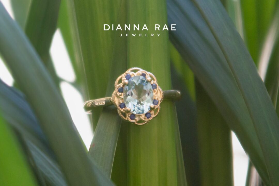 Yellow Gold Oval-Cut Aquamarine Ring with Scalloped Sapphire Halo