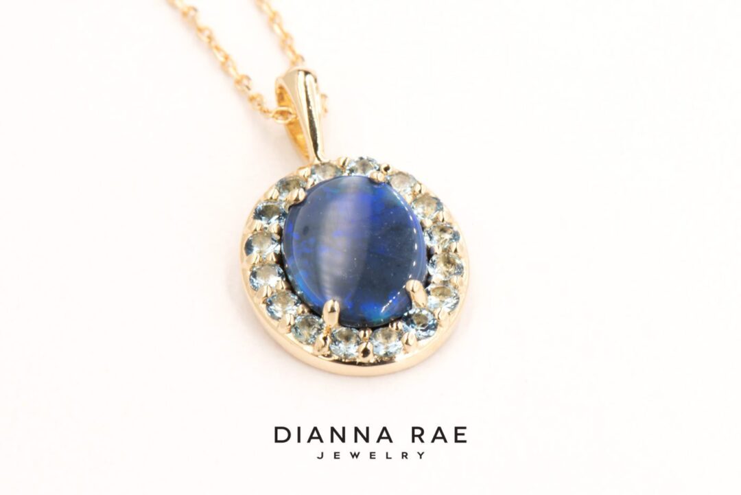 Yellow Gold Oval Black Opal Pendant with Aquamarine Halo