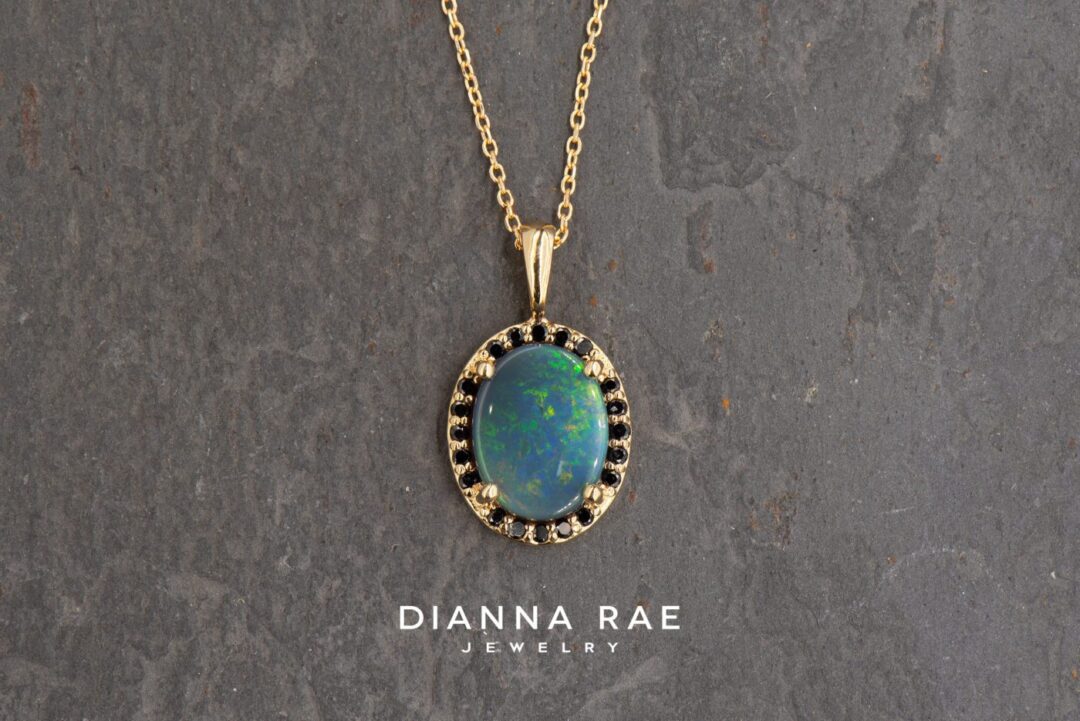 Yellow Gold Oval Black Opal Pendant with Black Diamond Halo