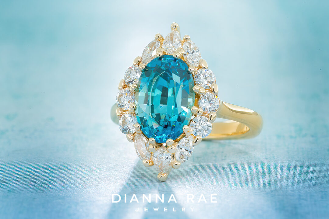 Oval Blue Zircon Ring with Diamond Halo