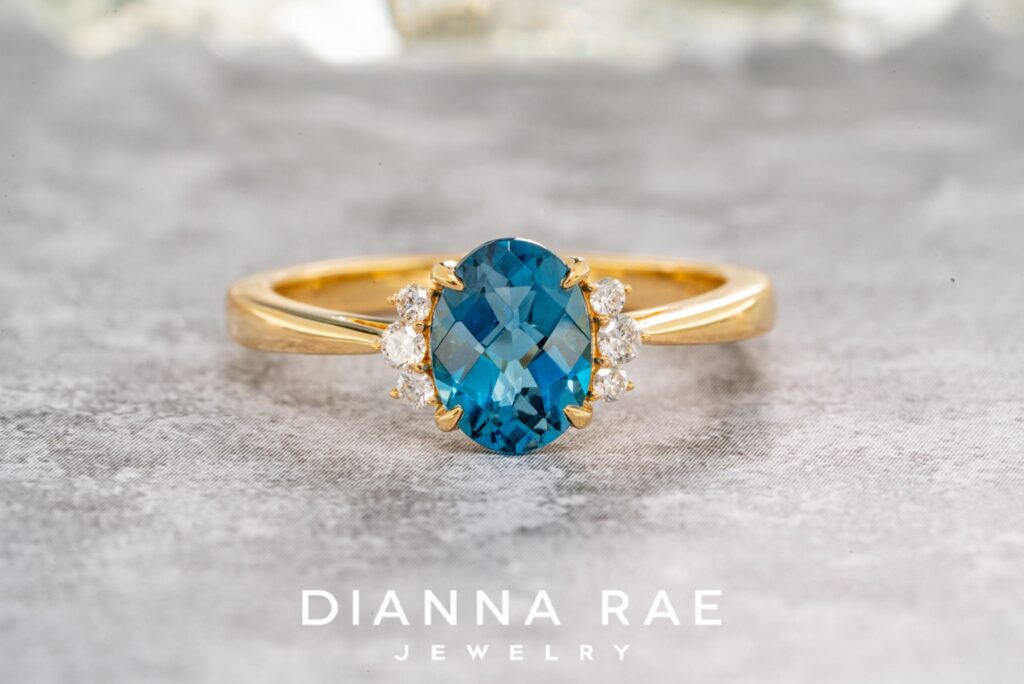 14K Yellow Gold Oval Blue Topaz Ring with Diamond Accents