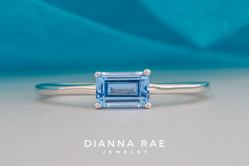 10K White Gold Ring with an Imitation Aqua Center Stone