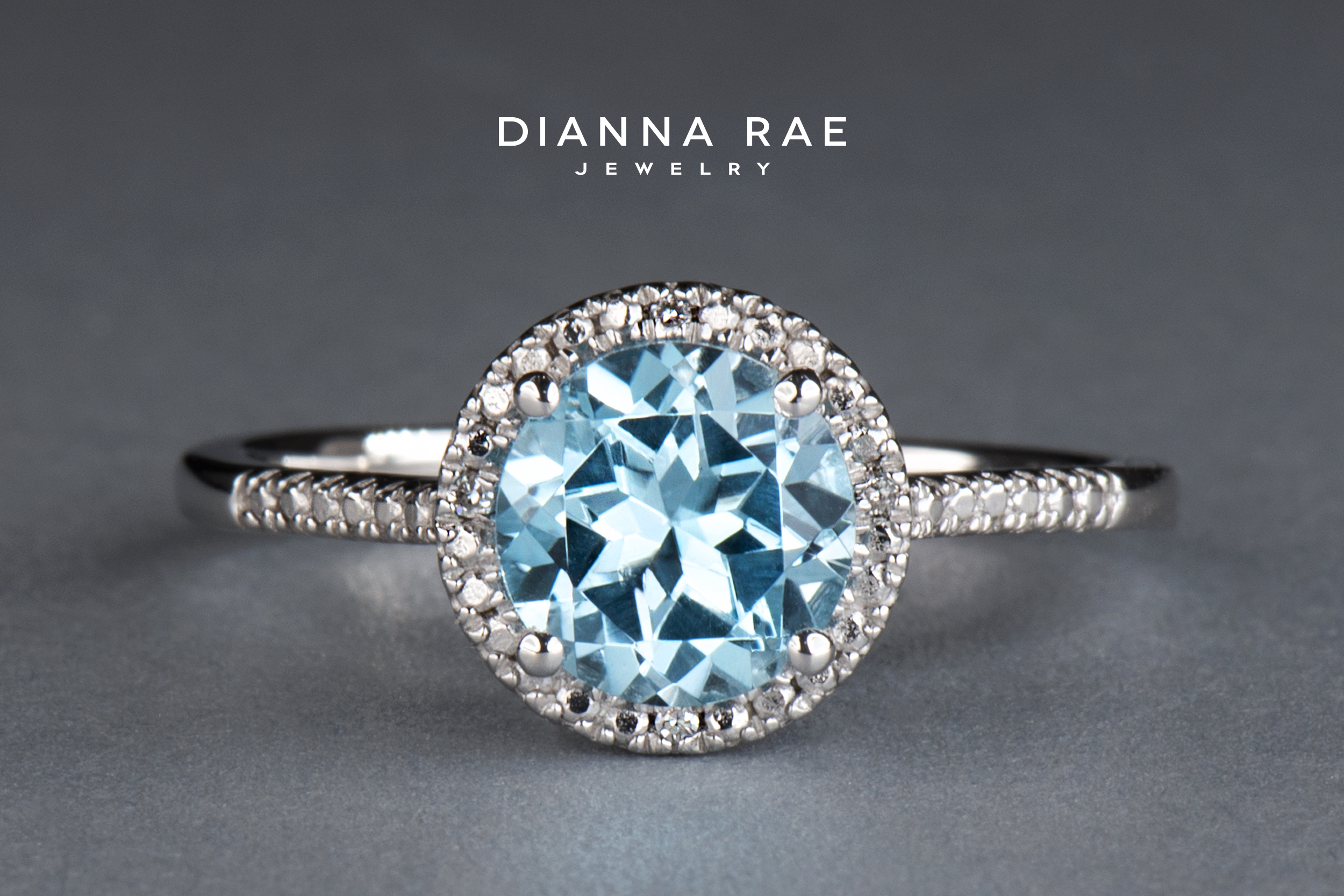 Sterling Silver Round Sky Blue Topaz and Diamond Ring