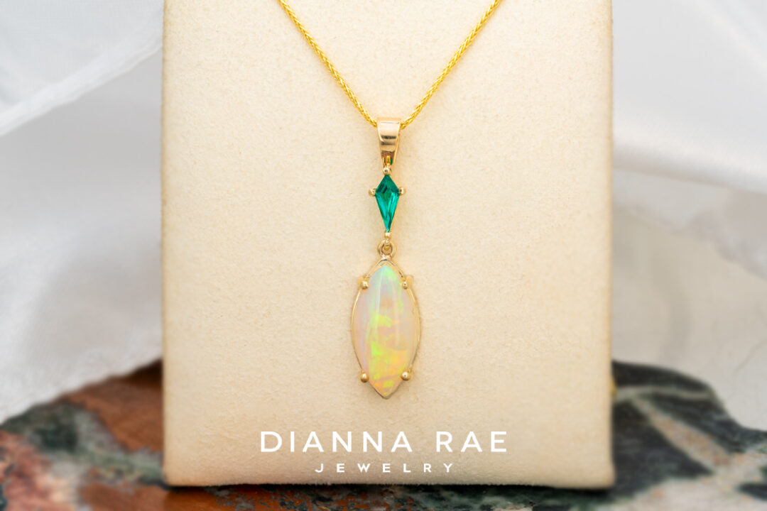 14K Yellow Gold Opal Pendant with Lab-Grown Emerald Accent