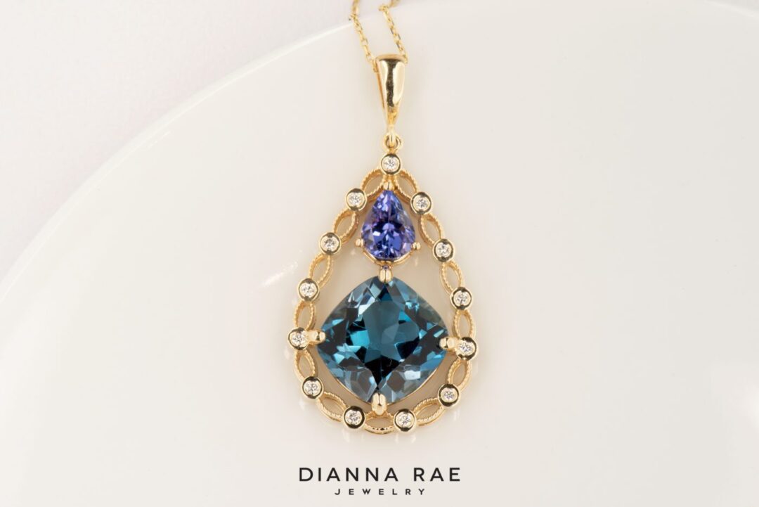 Brilliant Lace  - Yellow Gold Topaz and Tanzanite Halo Style Pendant