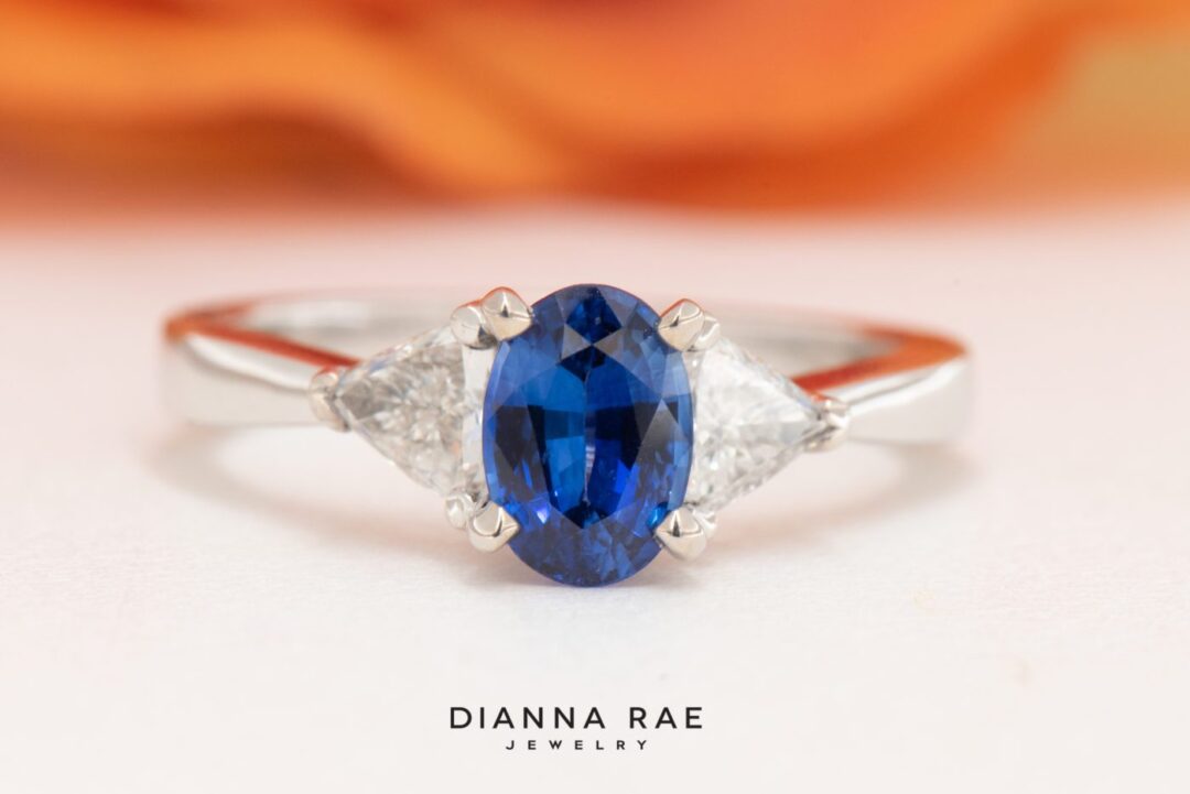 Platinum Oval Sapphire and Trillion Diamond Ring