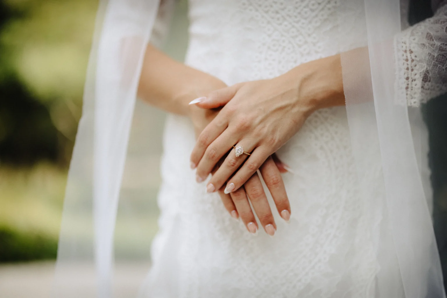 Bride getting ready for wedding with custom engagement ring designed by Dianna Rae Jewelry in Lafayette