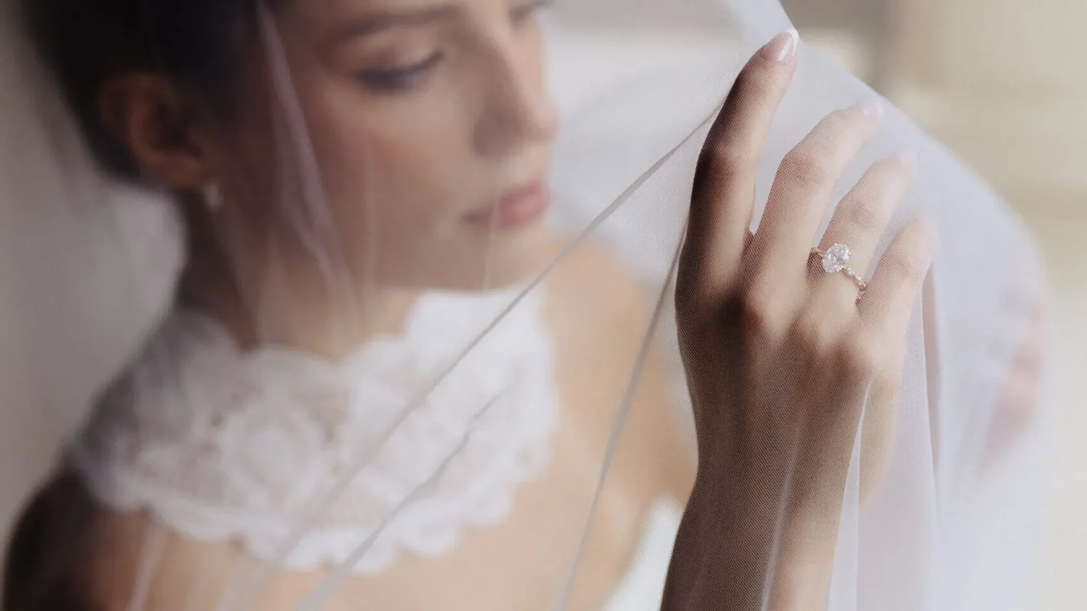 Bride getting ready for wedding with custom engagement ring designed by Dianna Rae Jewelry in Lafayette